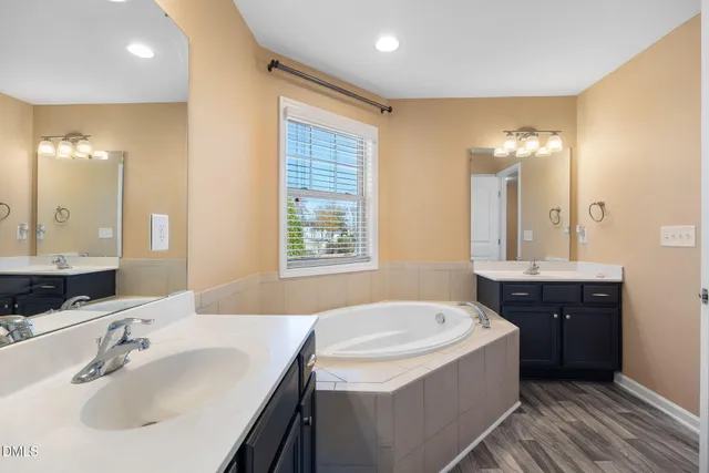 a bathroom with a bathtub and a sink