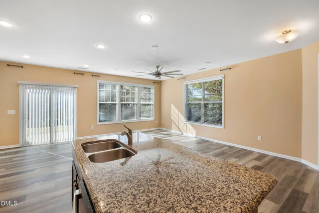 a kitchen with granite countertop sink and granite