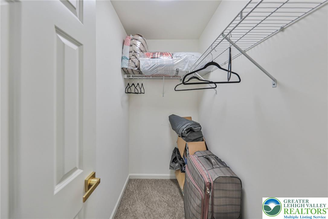 1105 Meco Road Easton, PA 18040 - Photo 70 of 100 Ample wire shelving and soft carpeting define this functional walk-in closet space.