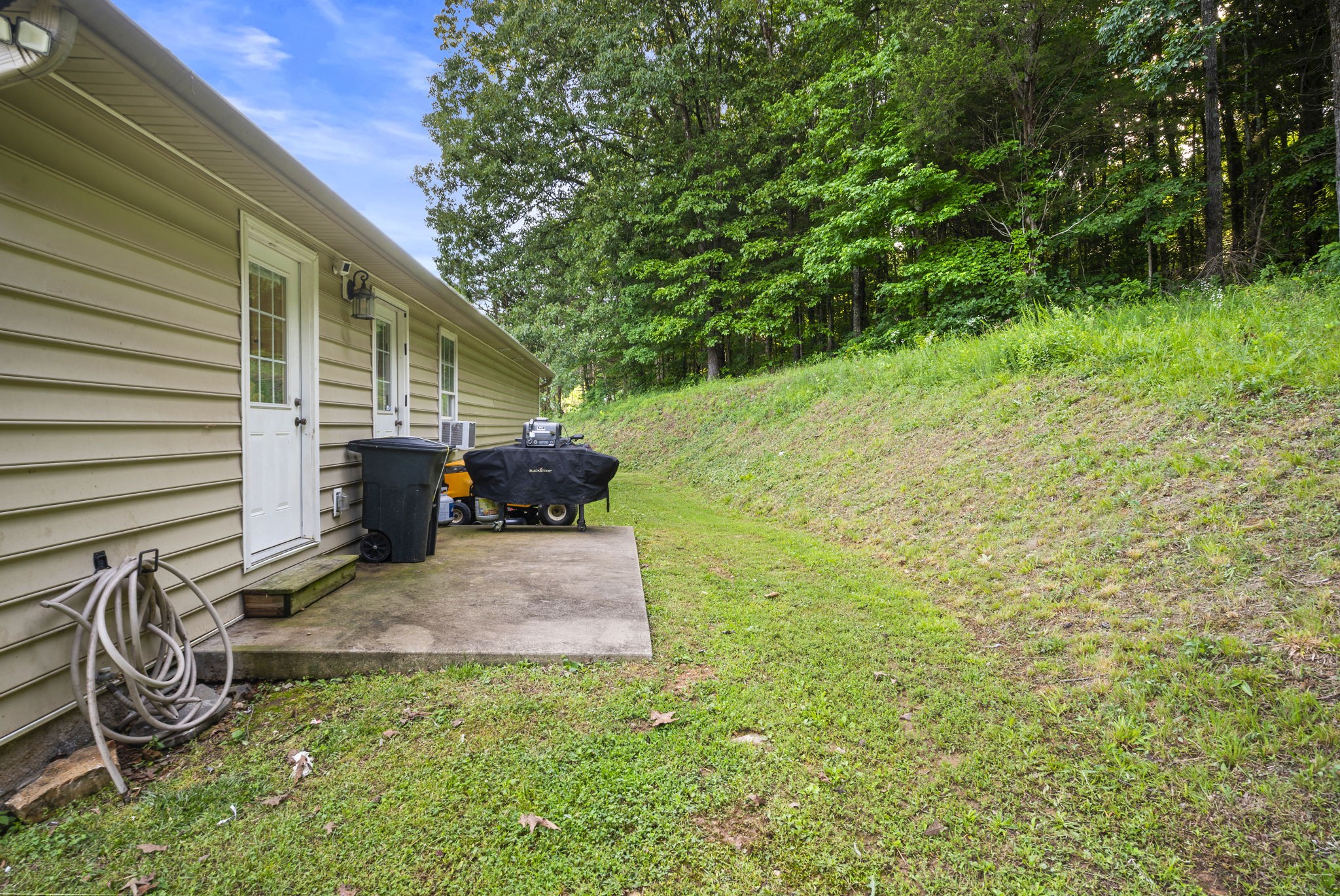 1197 Biter Road Cunningham, TN 37052 - Photo 36 of 38 a view of backyard with table and chairs and potted plants
