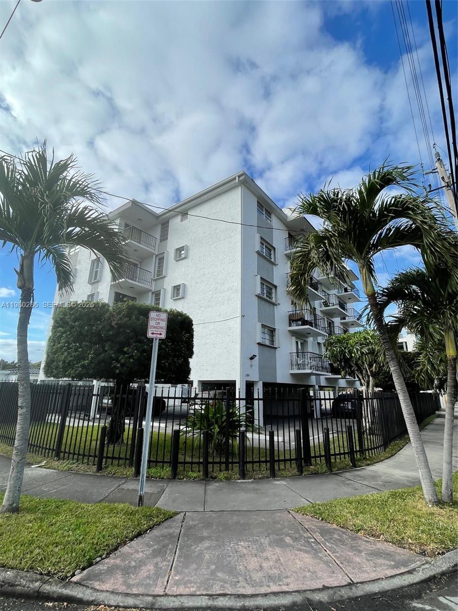 2500 Southwest 6th Street, Unit 404 Miami, FL 33135 - Photo 1 of 19 a backyard of a house with lots of green space