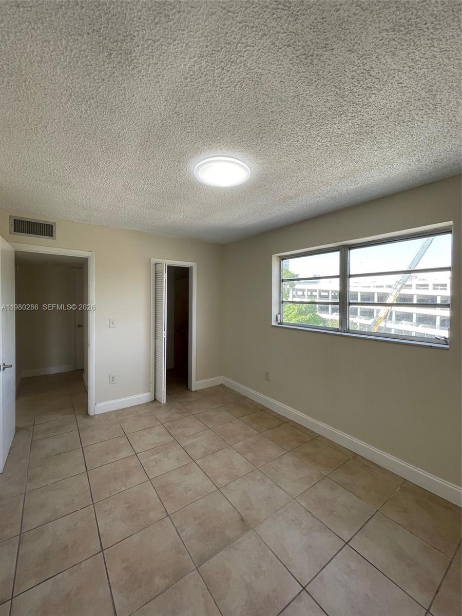 2500 Southwest 6th Street, Unit 404 Miami, FL 33135 - Photo 13 of 19 an empty room with windows