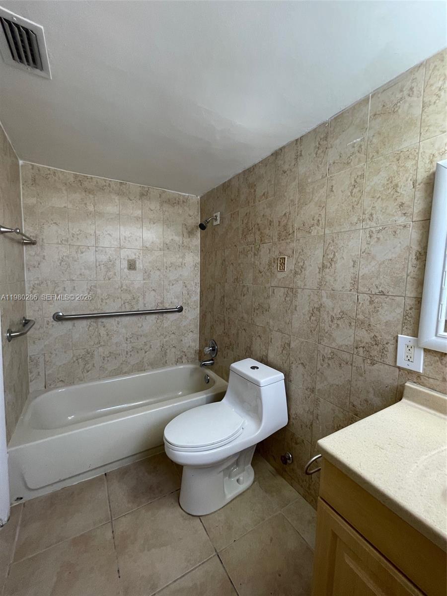 2500 Southwest 6th Street, Unit 404 Miami, FL 33135 - Photo 15 of 19 a bathroom with a sink a toilet and bathtub