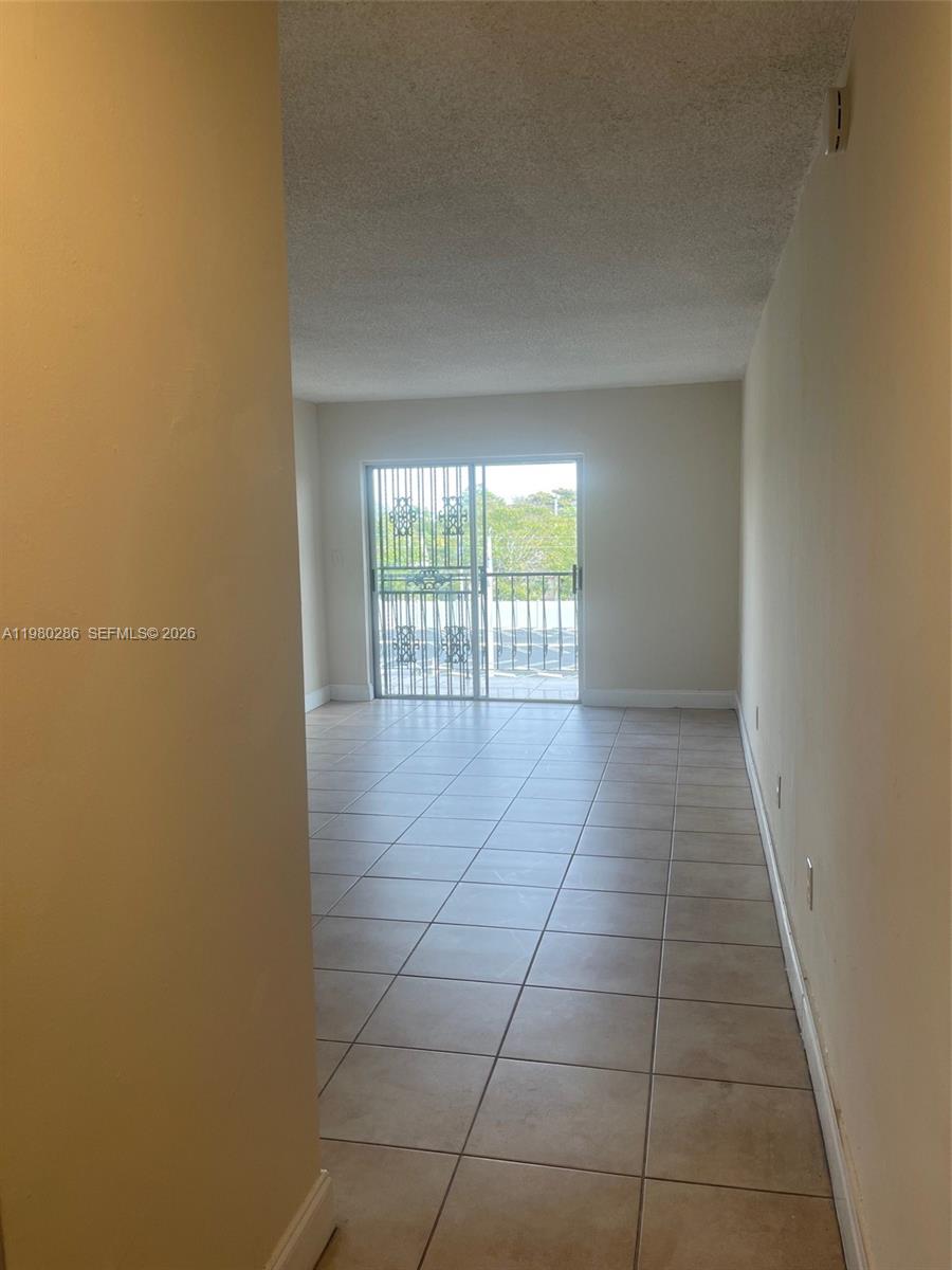 2500 Southwest 6th Street, Unit 404 Miami, FL 33135 - Photo 5 of 19 a view of an empty room and window
