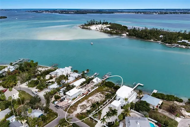 an aerial view of a house with ocean view