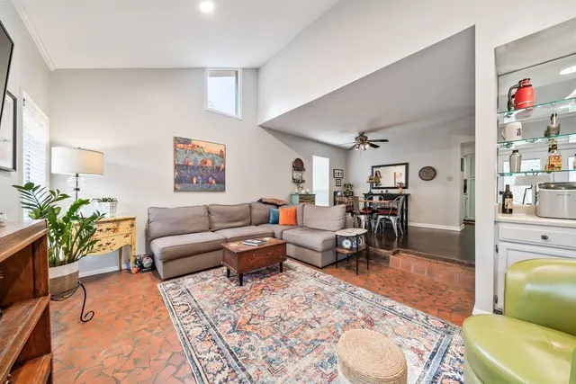 a living room with furniture rug and window