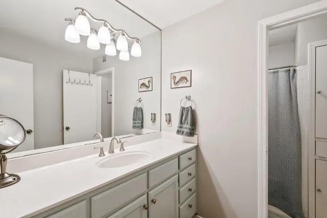 a bathroom with a sink and a mirror