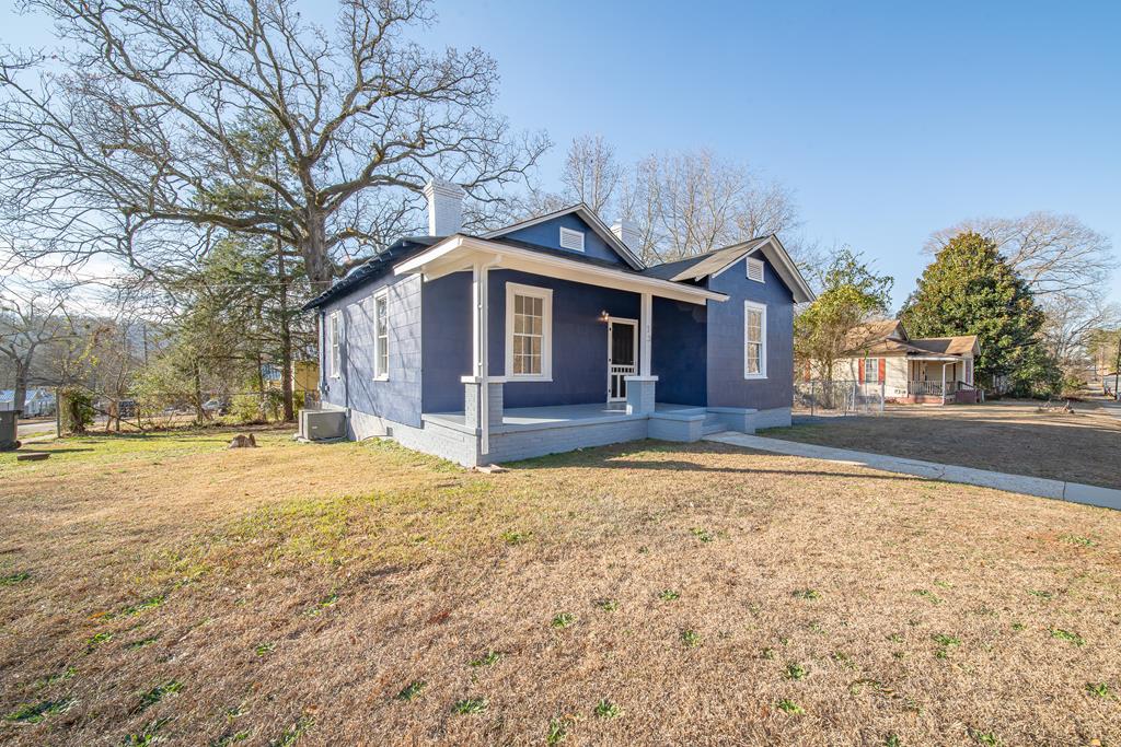 a front view of a house with a yard