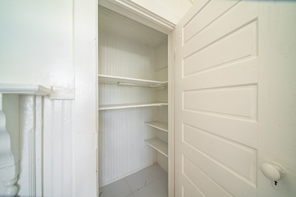 13 Perry Street Manchester, GA 31816 - Photo 17 of 24 a view of walk in closet with empty racks