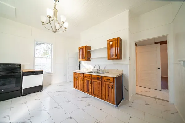 a spacious bathroom with a sink a mirror and a bathtub