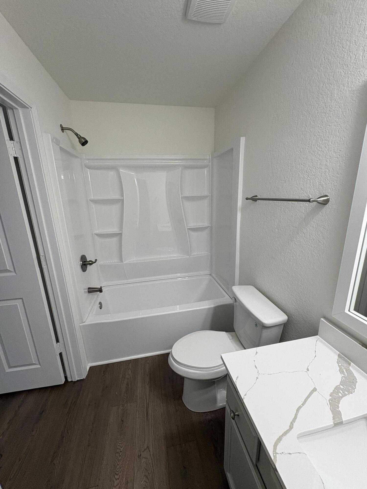 1014 Airport Road, Unit 138 Destin, FL 32541 - Photo 12 of 21 a bathroom with a sink a toilet and shower