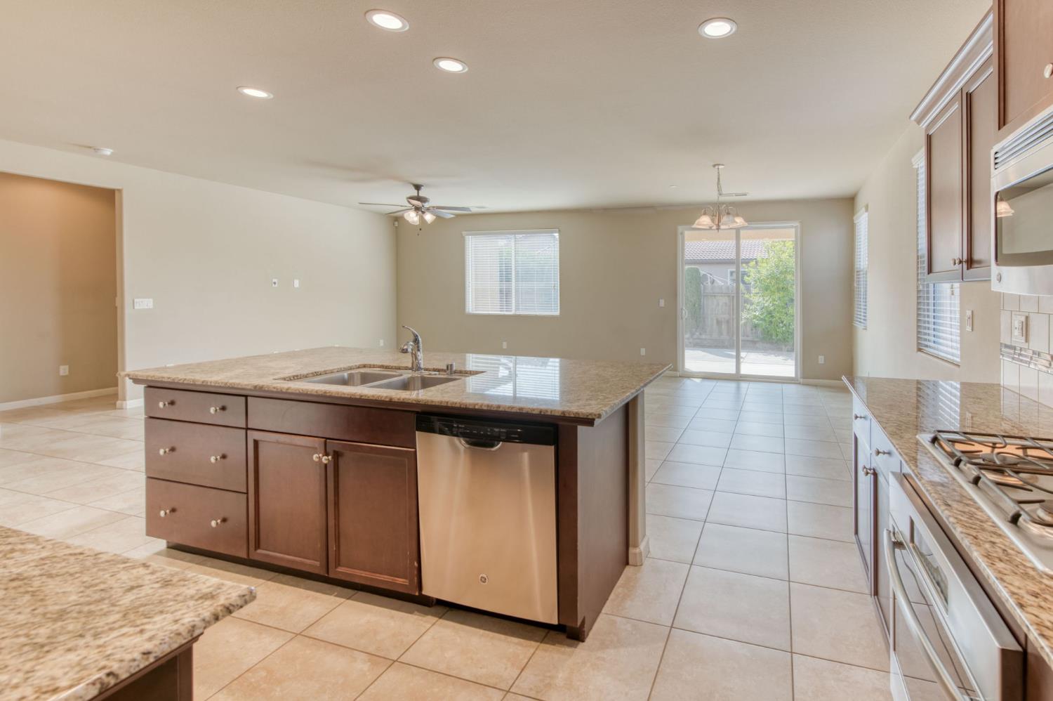 3460 Griffith Avenue Clovis, CA 93619 - Photo 19 of 28 a kitchen with a sink stove and cabinets