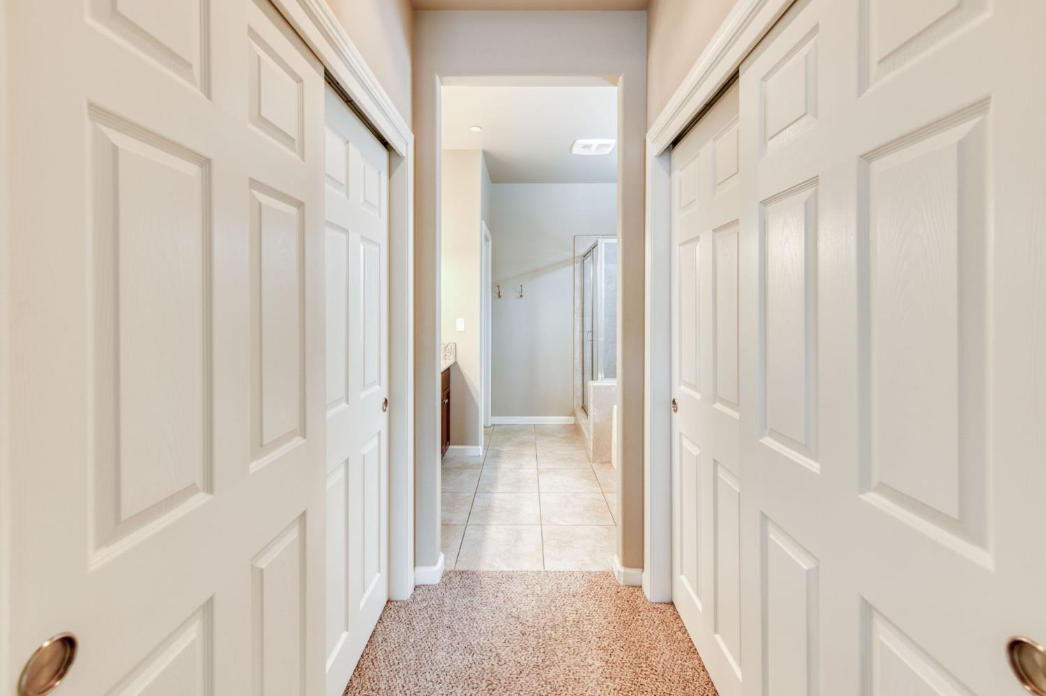 3460 Griffith Avenue Clovis, CA 93619 - Photo 3 of 28 a view of a hallway with wooden floor and staircase
