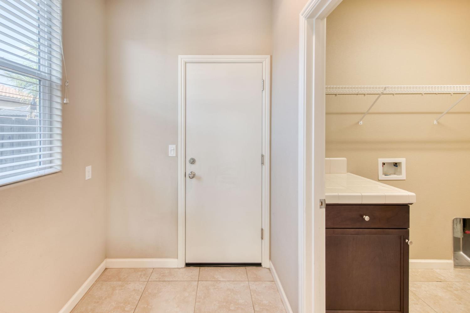 3460 Griffith Avenue Clovis, CA 93619 - Photo 6 of 28 a view of a bathroom from a hallway