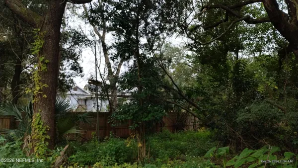 a view of a house in a forest