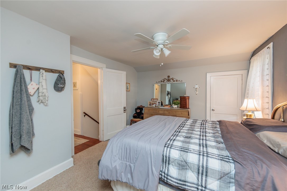 5364 Summit Road Lyndhurst, OH 44124 - Photo 21 of 42 Comfortable interior space featuring a ceiling fan with integrated lighting, a paneled door, and neutral-toned wall paint