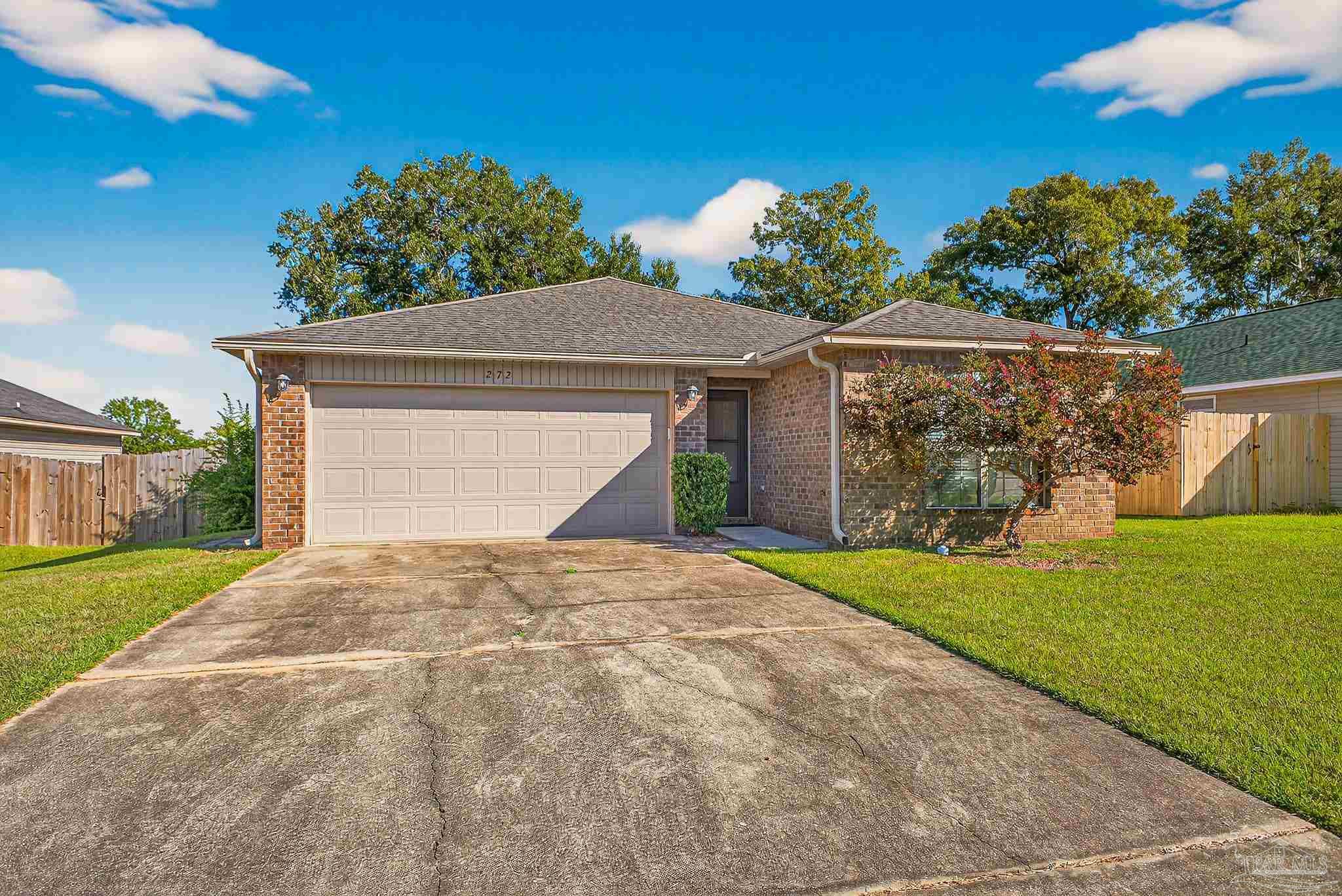 272 Millet Circle Cantonment, FL 32533 - Photo 1 of 57 a front view of a house with garden