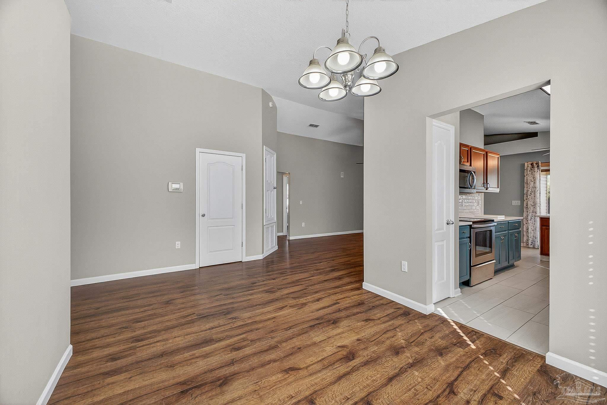 272 Millet Circle Cantonment, FL 32533 - Photo 16 of 57 a view of a kitchen with a sink and refrigerator