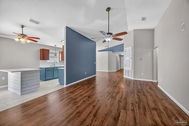 a view of bedroom with wooden floor