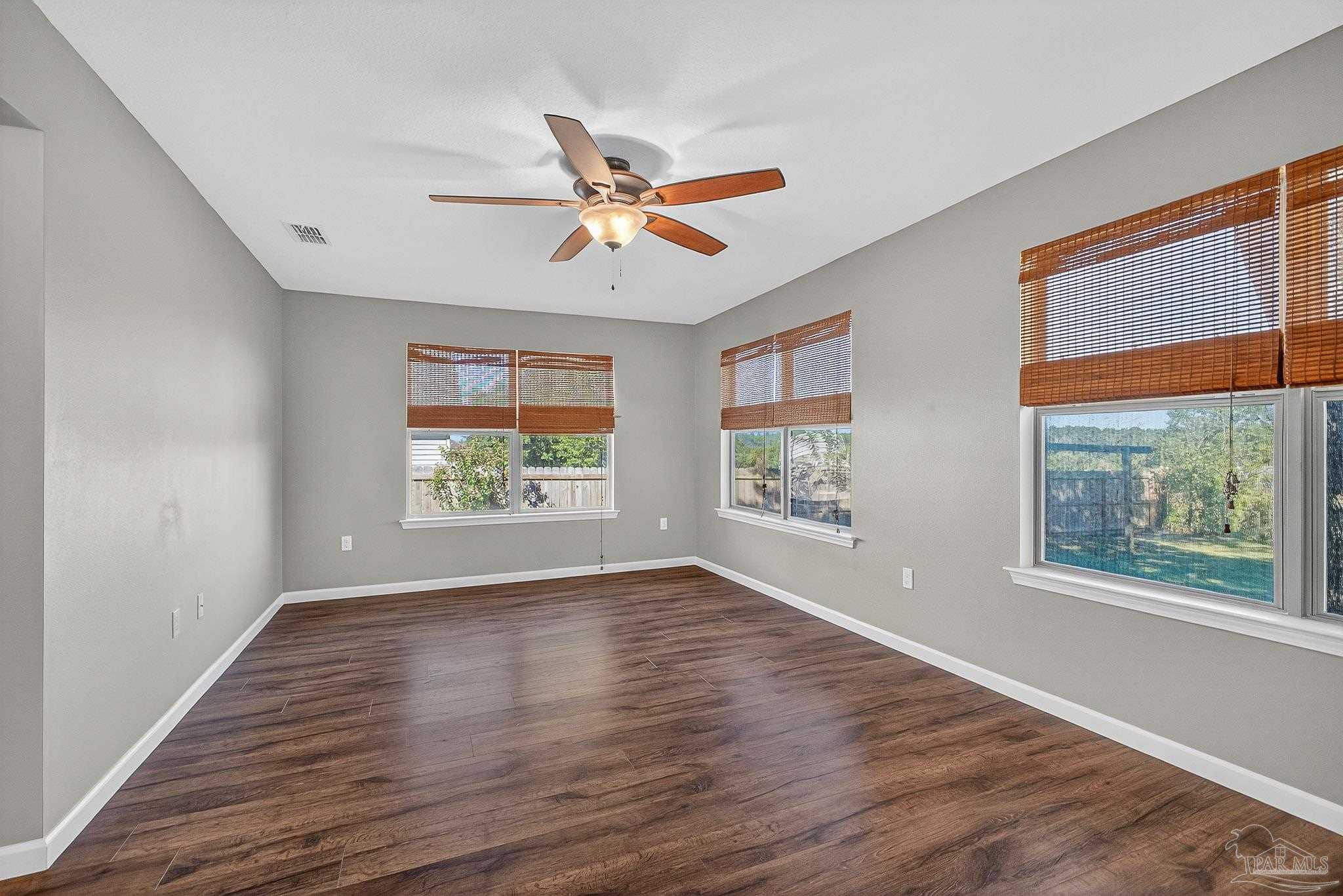 272 Millet Circle Cantonment, FL 32533 - Photo 23 of 57 wooden floor in an empty room with a window