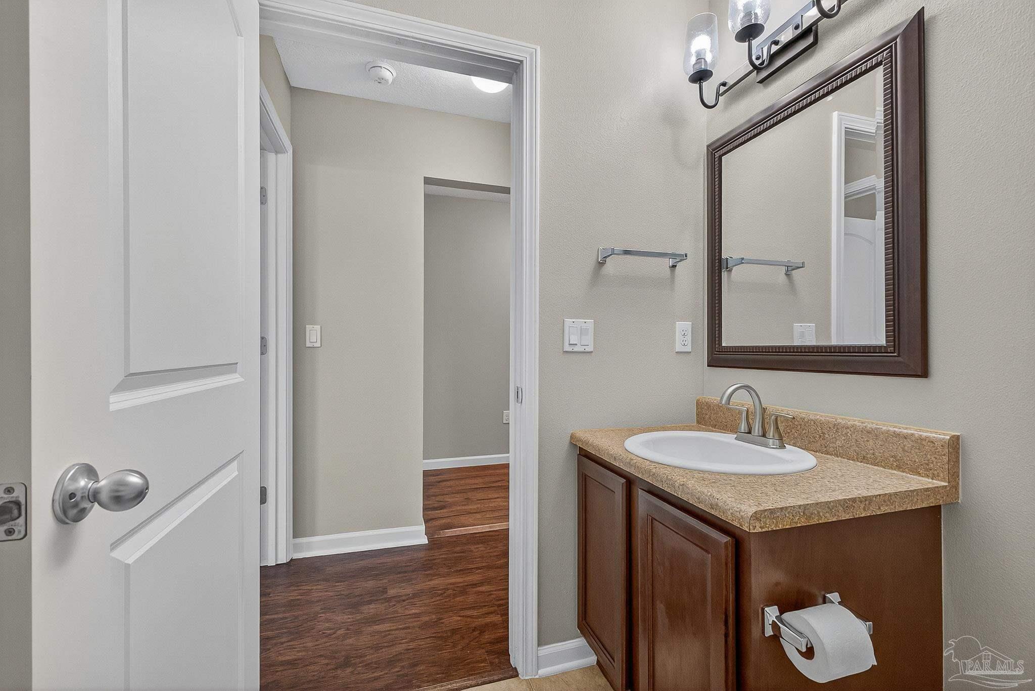 272 Millet Circle Cantonment, FL 32533 - Photo 27 of 57 a bathroom with a sink and a mirror