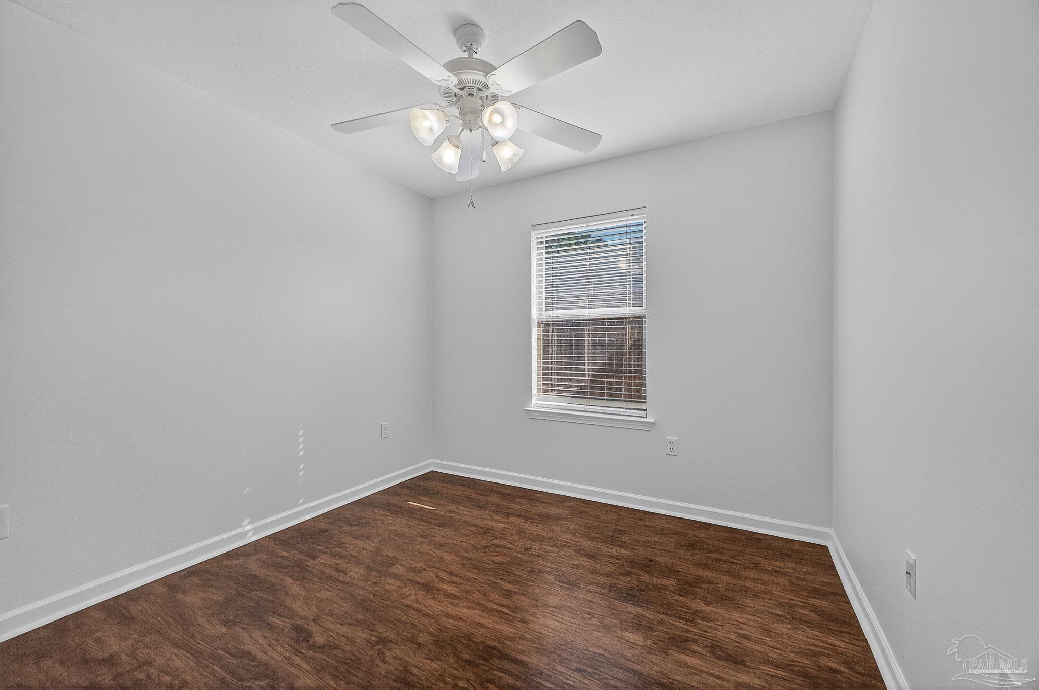 272 Millet Circle Cantonment, FL 32533 - Photo 28 of 57 an empty room with wooden floor and windows