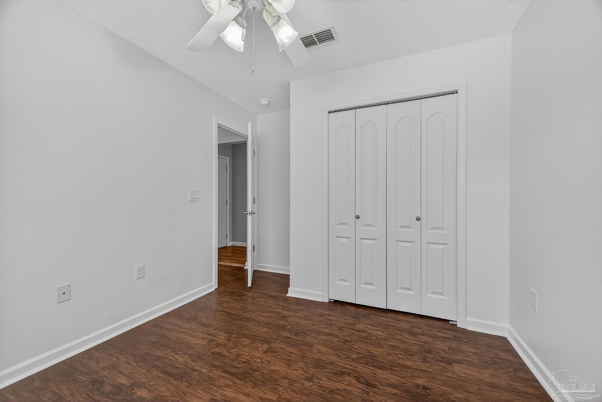 272 Millet Circle Cantonment, FL 32533 - Photo 30 of 57 a view of an empty room with wooden floor