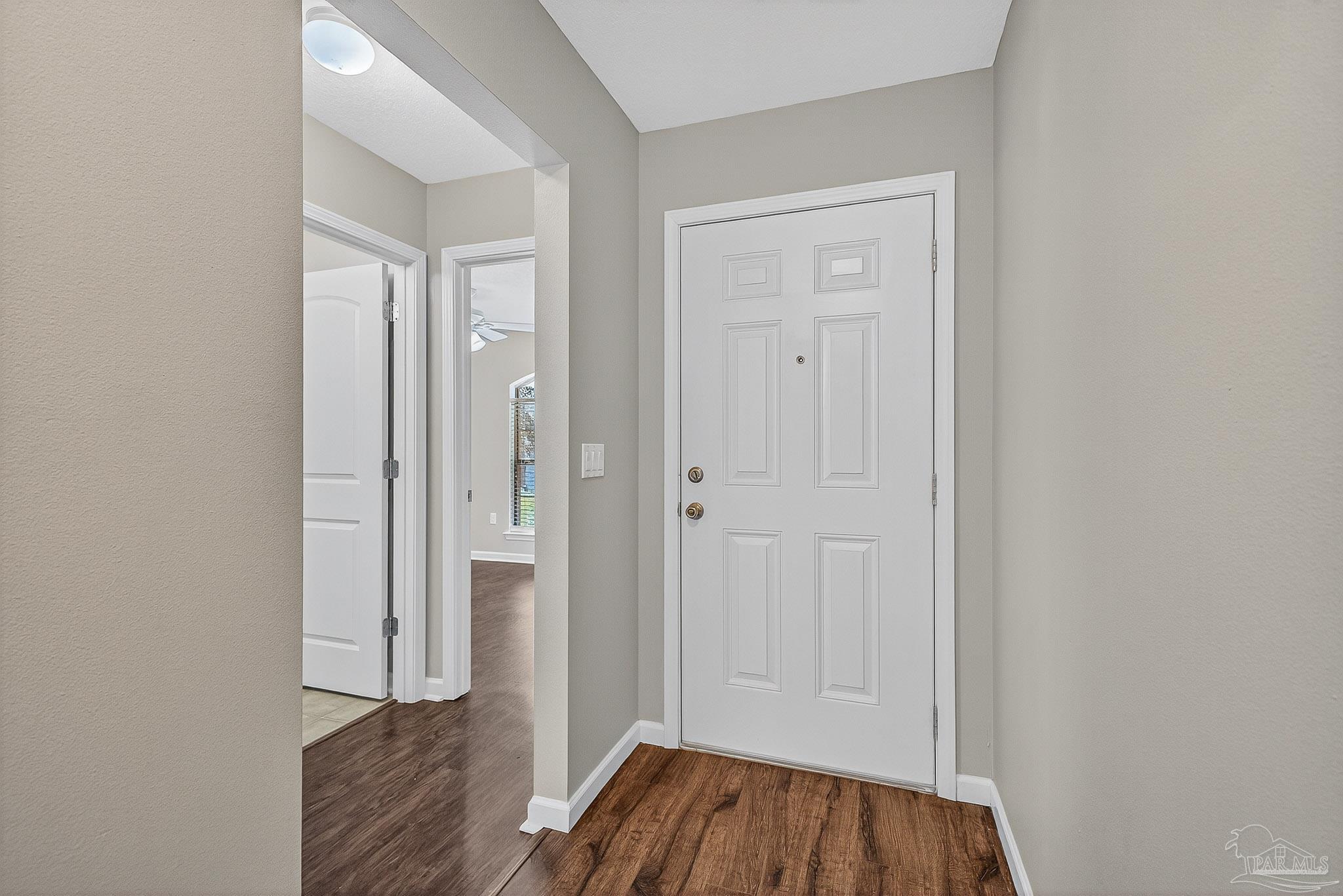 272 Millet Circle Cantonment, FL 32533 - Photo 32 of 57 a view of a hallway with wooden floor and closet