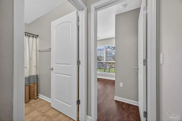 a bathroom with a toilet sink and a mirror