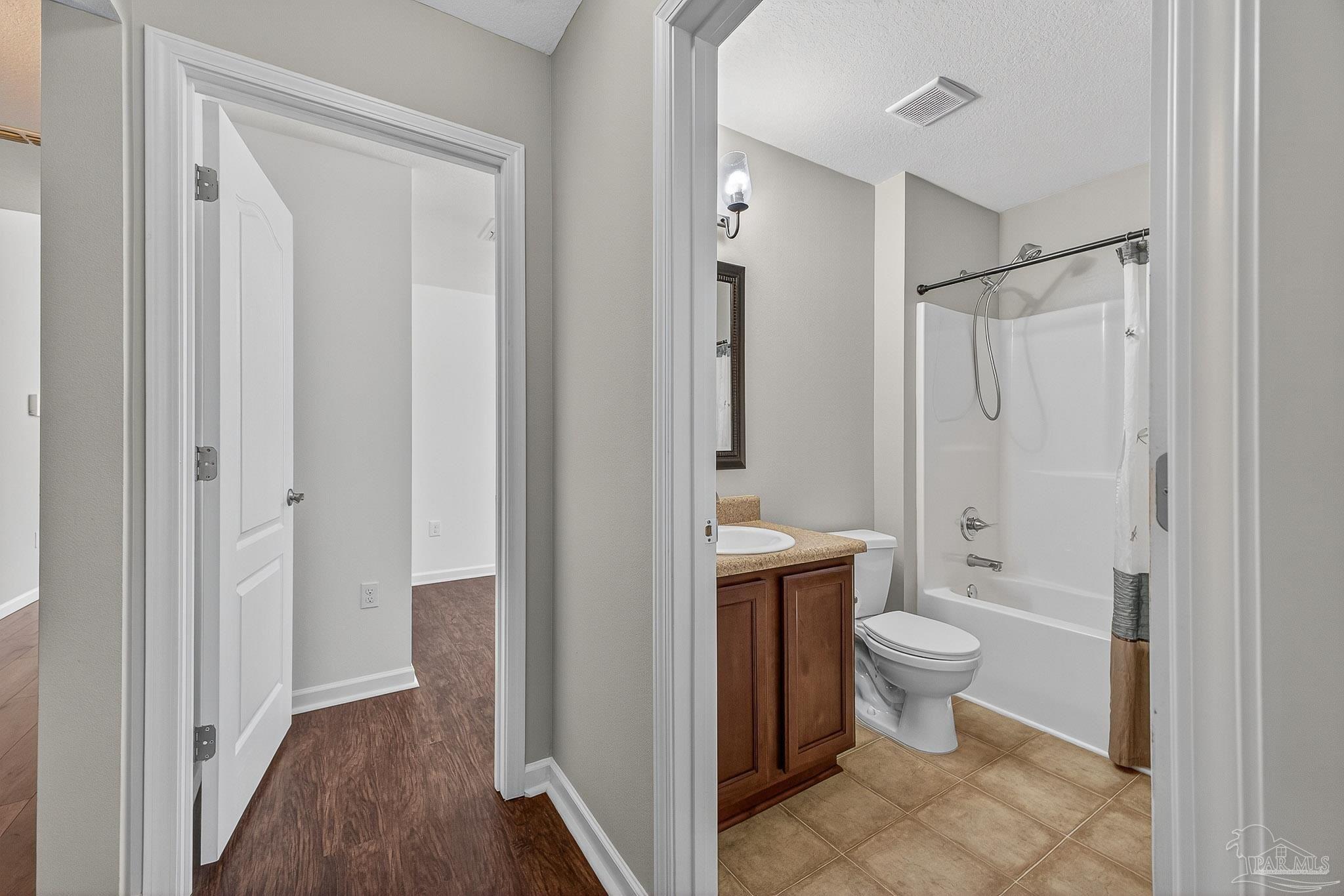 272 Millet Circle Cantonment, FL 32533 - Photo 37 of 57 a bathroom with a toilet sink and a mirror