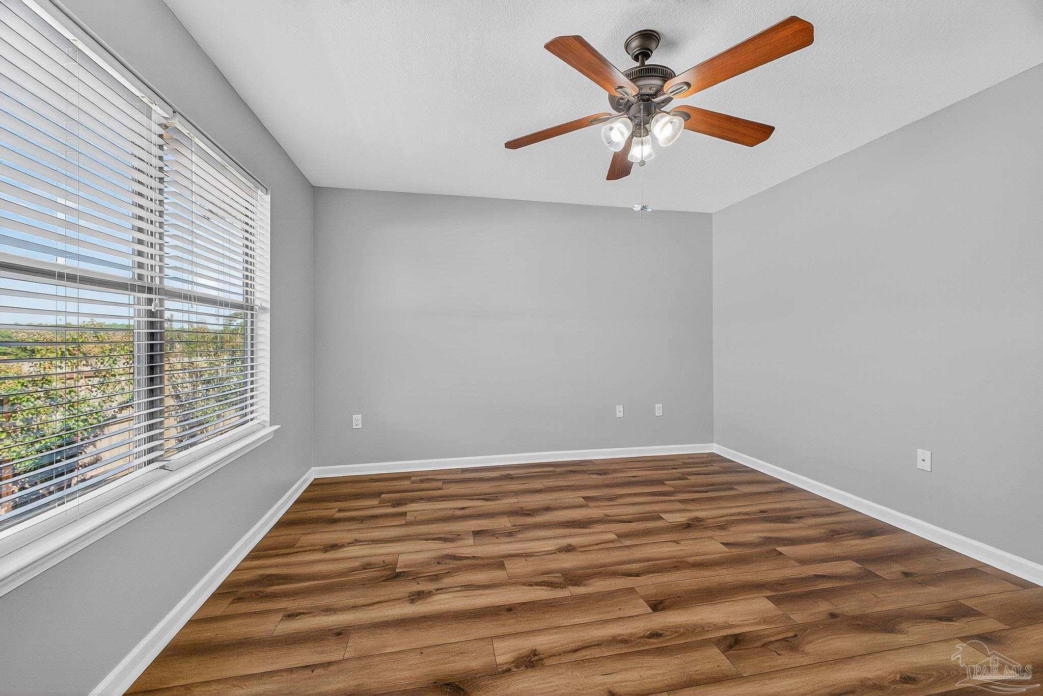 272 Millet Circle Cantonment, FL 32533 - Photo 39 of 57 wooden floor in an empty room with a window