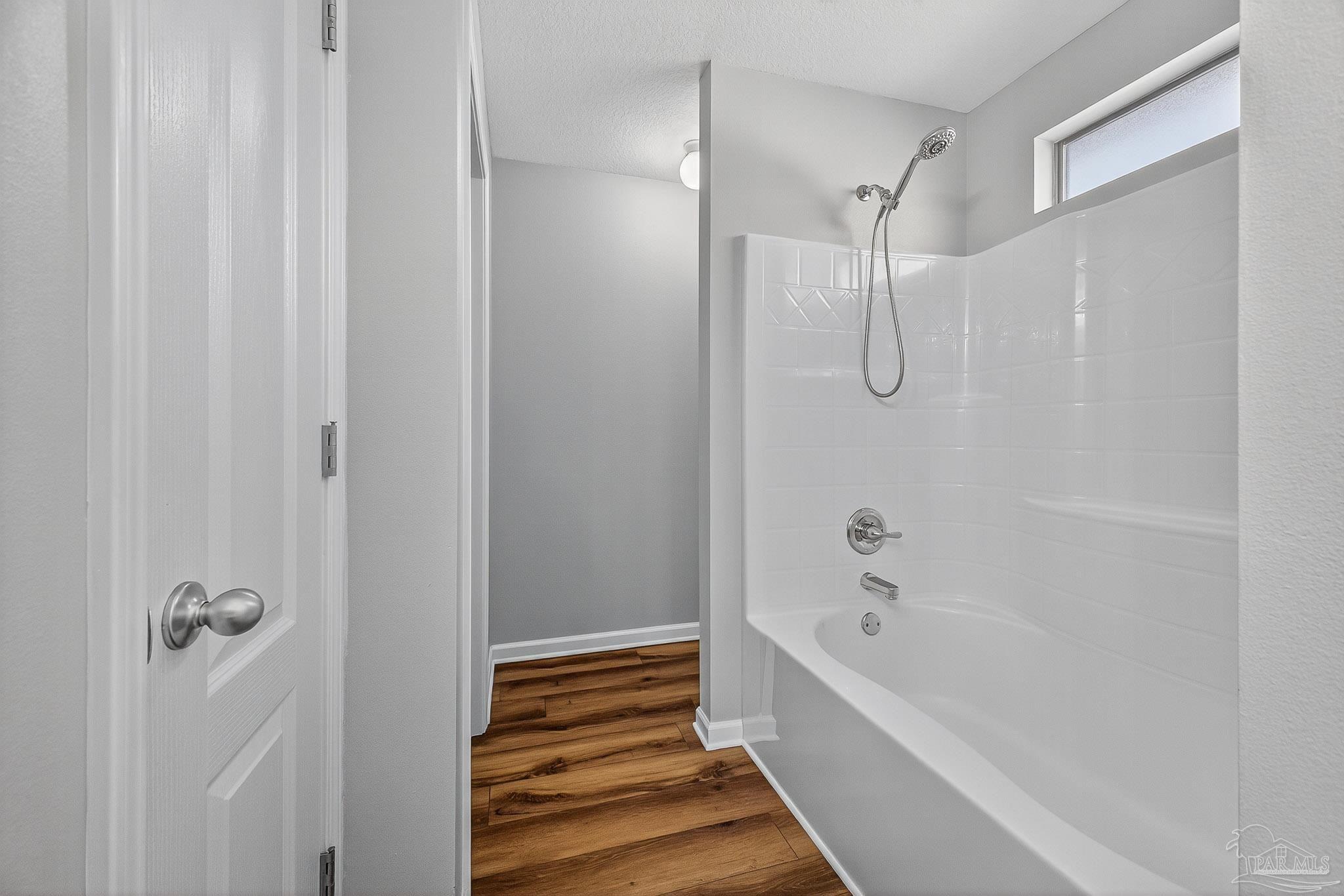 272 Millet Circle Cantonment, FL 32533 - Photo 43 of 57 a bathroom with a bathtub and a shower