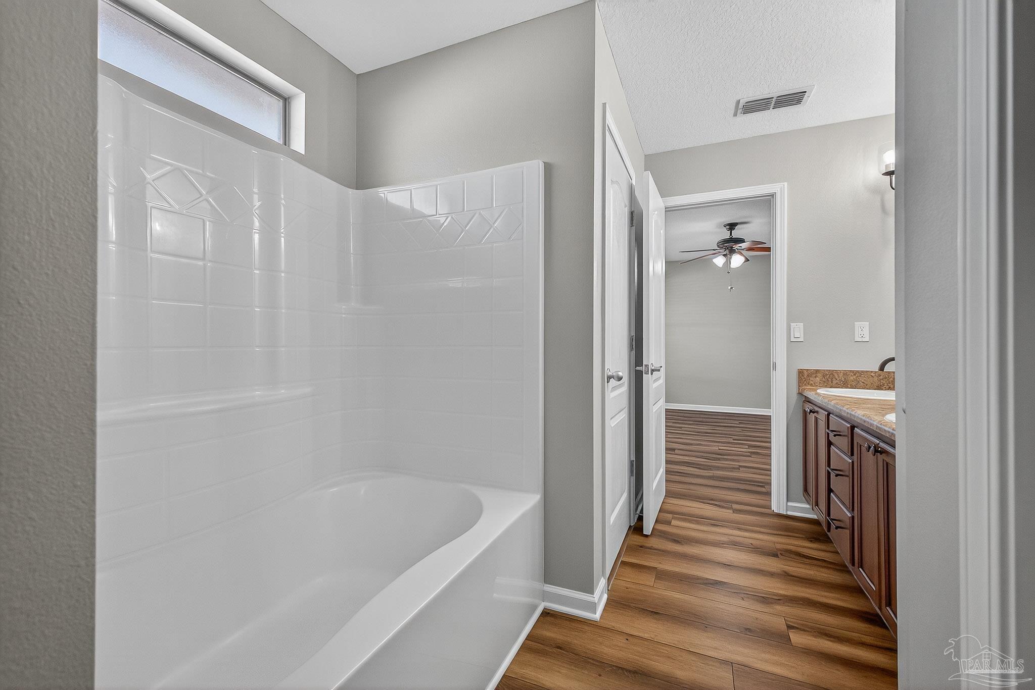 272 Millet Circle Cantonment, FL 32533 - Photo 46 of 57 a bathroom with a bathtub and a shower