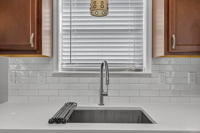 a view of a sink and a window