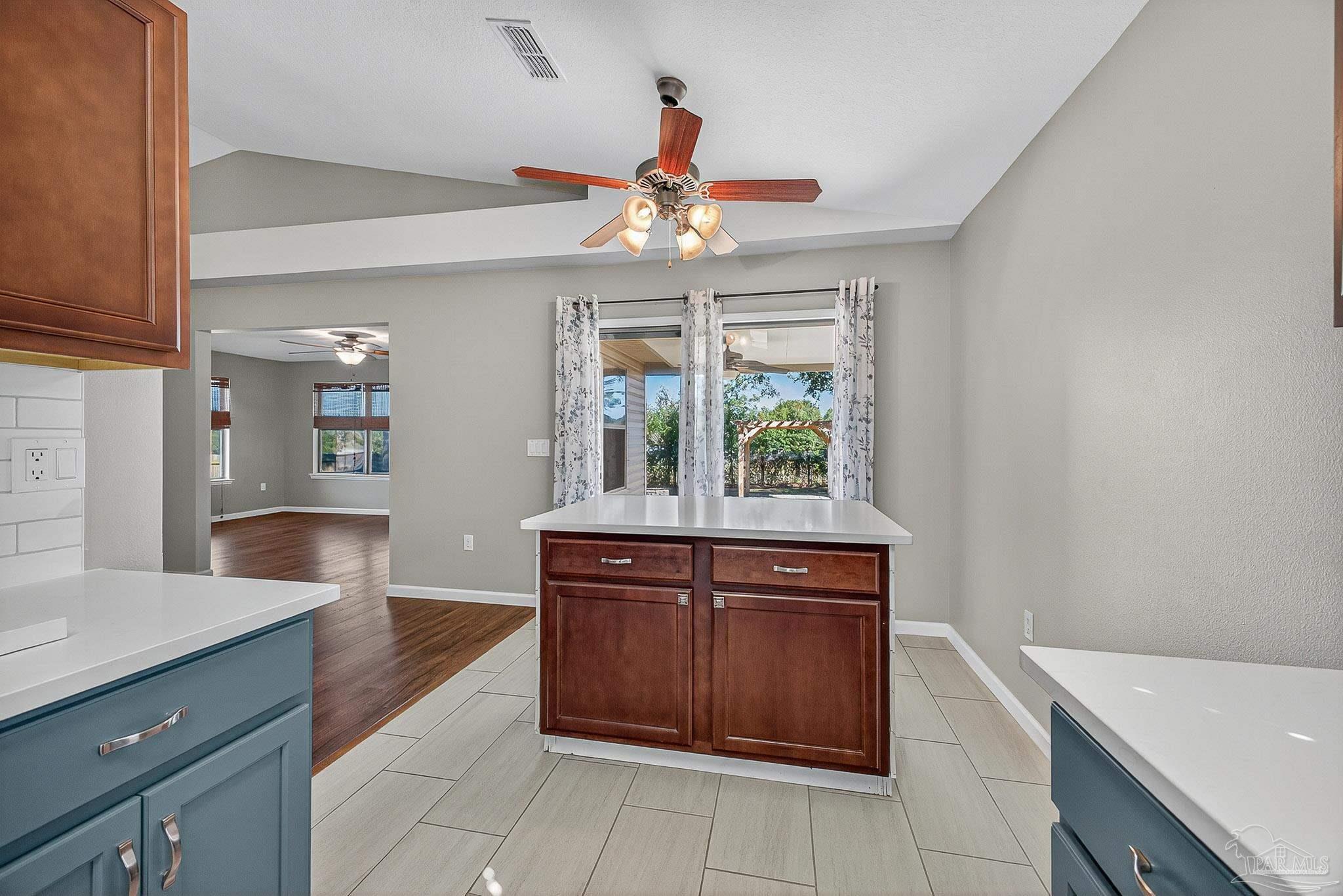 272 Millet Circle Cantonment, FL 32533 - Photo 9 of 57 a kitchen with a cabinets and window