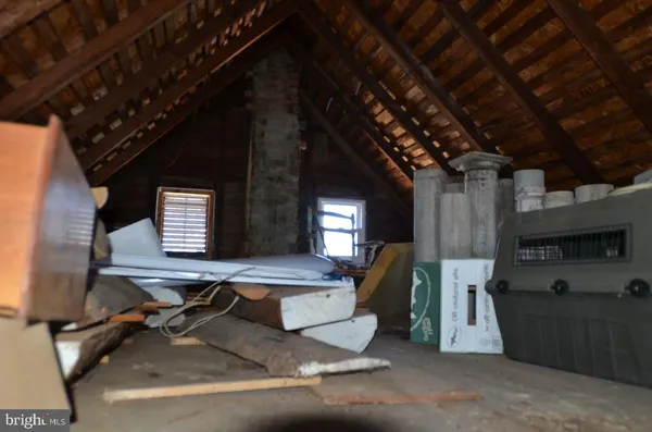 a room with pool table and windows