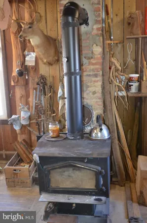 a stove top oven sitting inside of a kitchen