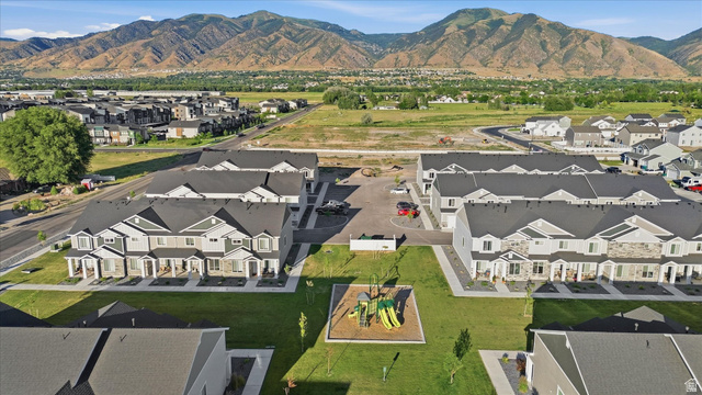 2257 South 1090 West, Unit 74 Nibley, UT 84321 - Photo 38 of 40 Modern townhome community featuring a central green space with a playground