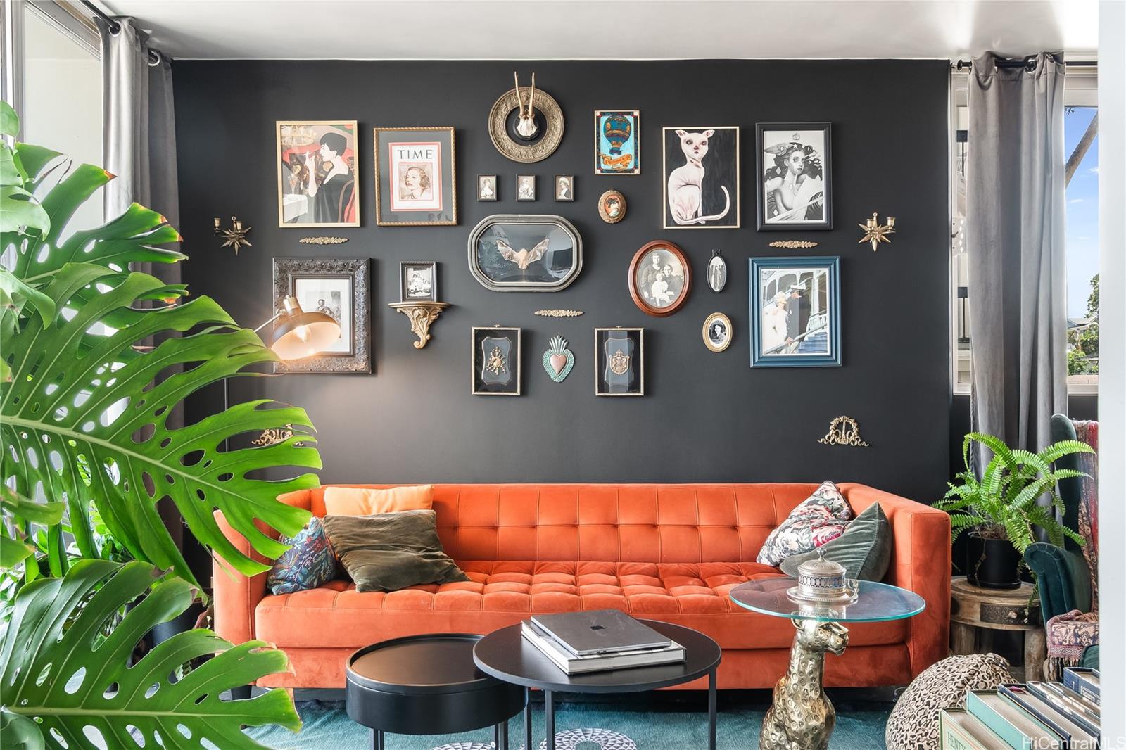 1069 Spencer Street, Unit 402 Honolulu, HI 96822 - Photo 1 of 16 a living room with furniture and a potted plant