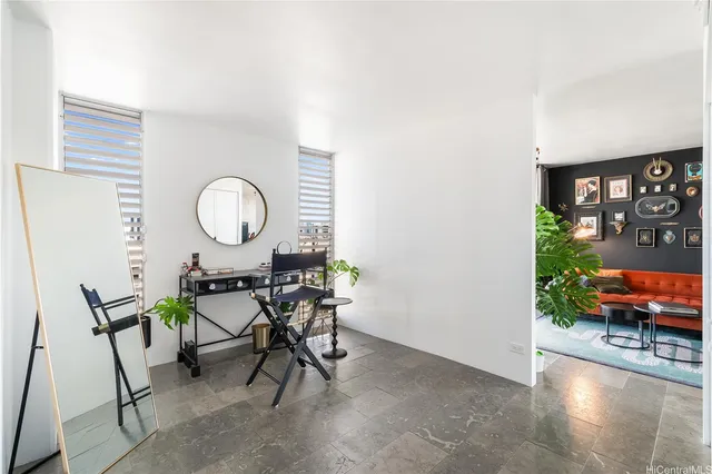 a living room with furniture and a large window