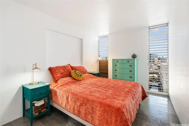 a bedroom with a bed and a closet