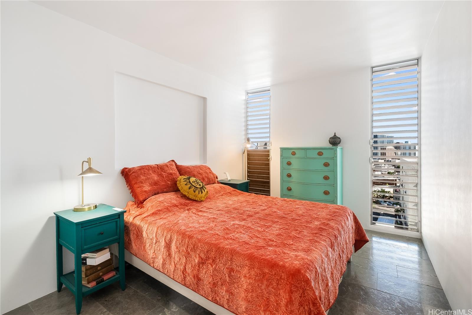 1069 Spencer Street, Unit 402 Honolulu, HI 96822 - Photo 9 of 16 a bedroom with a bed and a closet