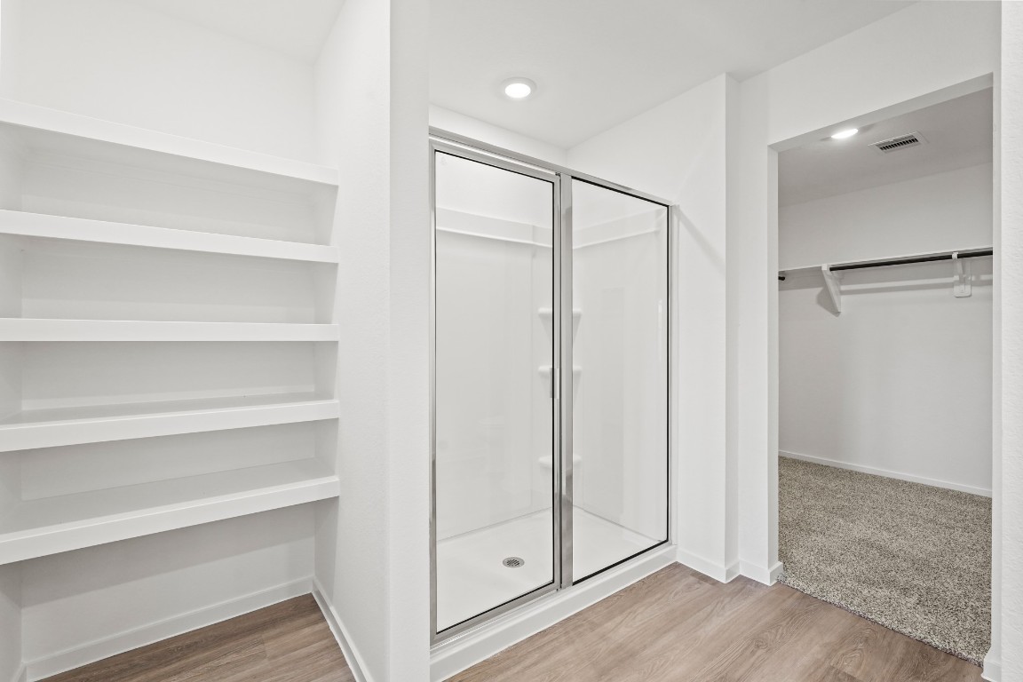 525 Wax Myrtle Way Hockley, TX 77447 - Photo 12 of 20 a bathroom with a shower and a glass door