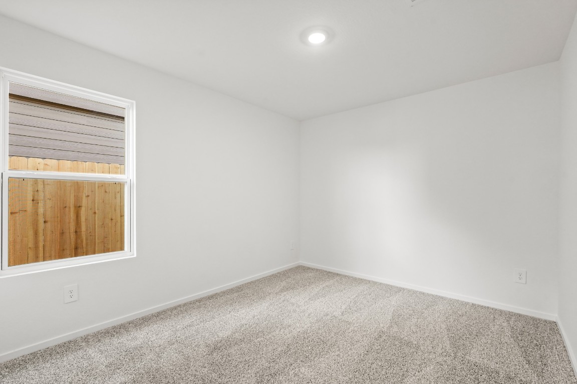 525 Wax Myrtle Way Hockley, TX 77447 - Photo 13 of 20 an empty room with a window