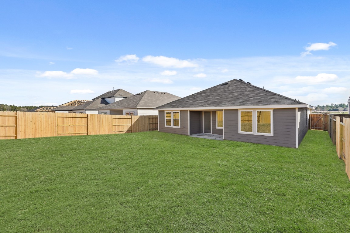 525 Wax Myrtle Way Hockley, TX 77447 - Photo 18 of 20 a view of a yard in front of a house with a yard