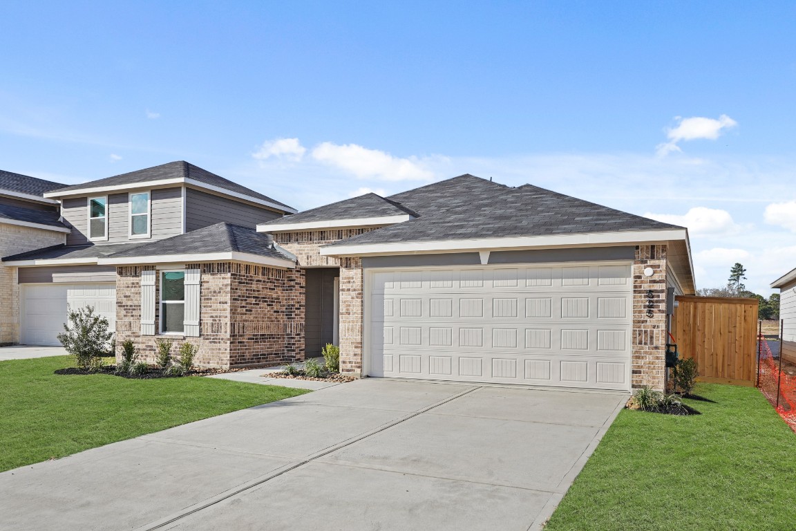 525 Wax Myrtle Way Hockley, TX 77447 - Photo 2 of 20 a front view of a house with garden