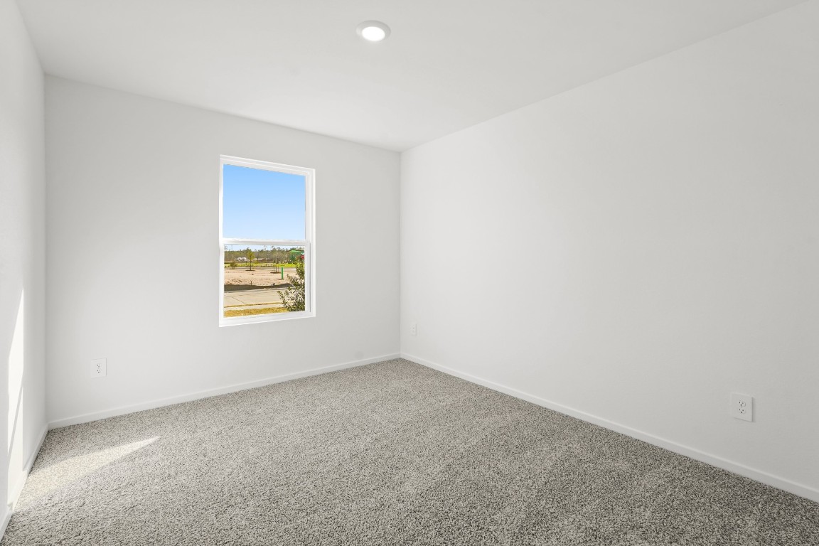 525 Wax Myrtle Way Hockley, TX 77447 - Photo 9 of 20 an empty room with a window