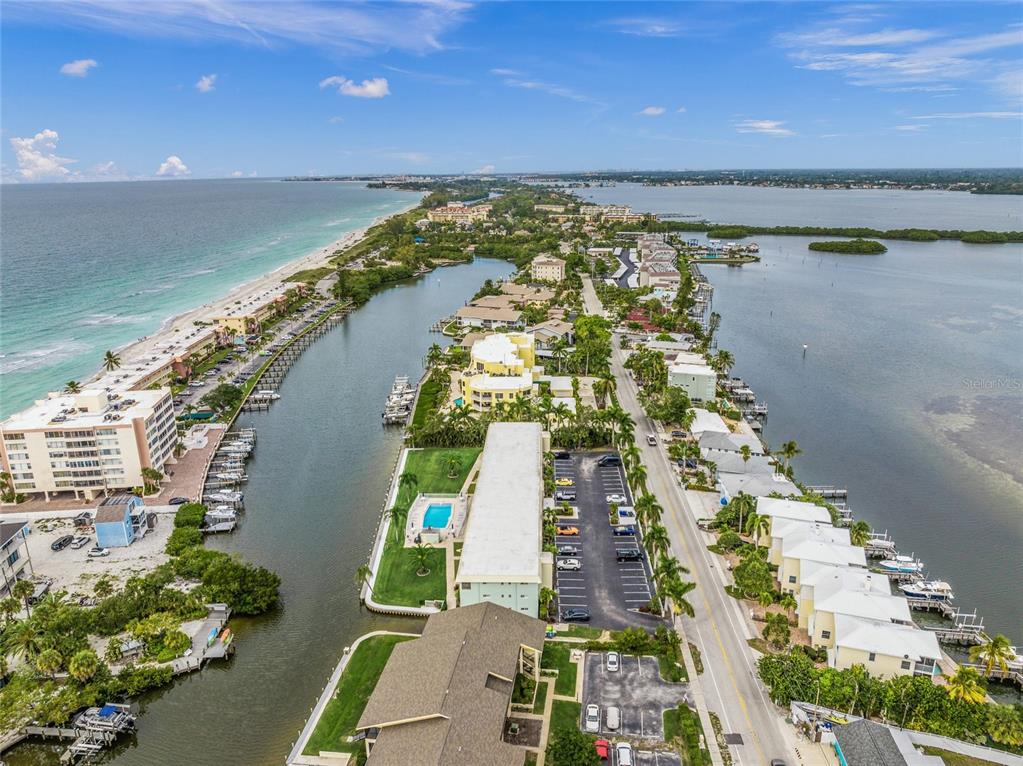 9200 Midnight Pass Road, Unit 17 Sarasota, FL 34242 - Photo 1 of 56 a view of a city with an ocean view