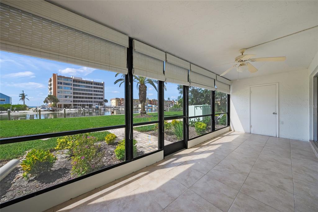 9200 Midnight Pass Road, Unit 17 Sarasota, FL 34242 - Photo 28 of 56 a view of a porch with a yard