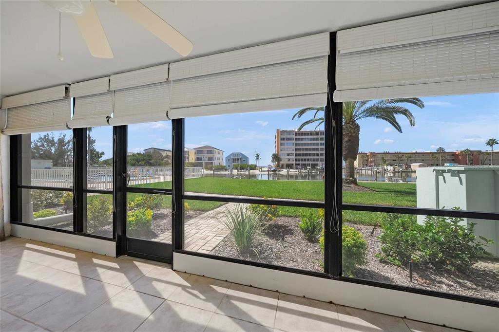 9200 Midnight Pass Road, Unit 17 Sarasota, FL 34242 - Photo 29 of 56 a view of a street with a big yard